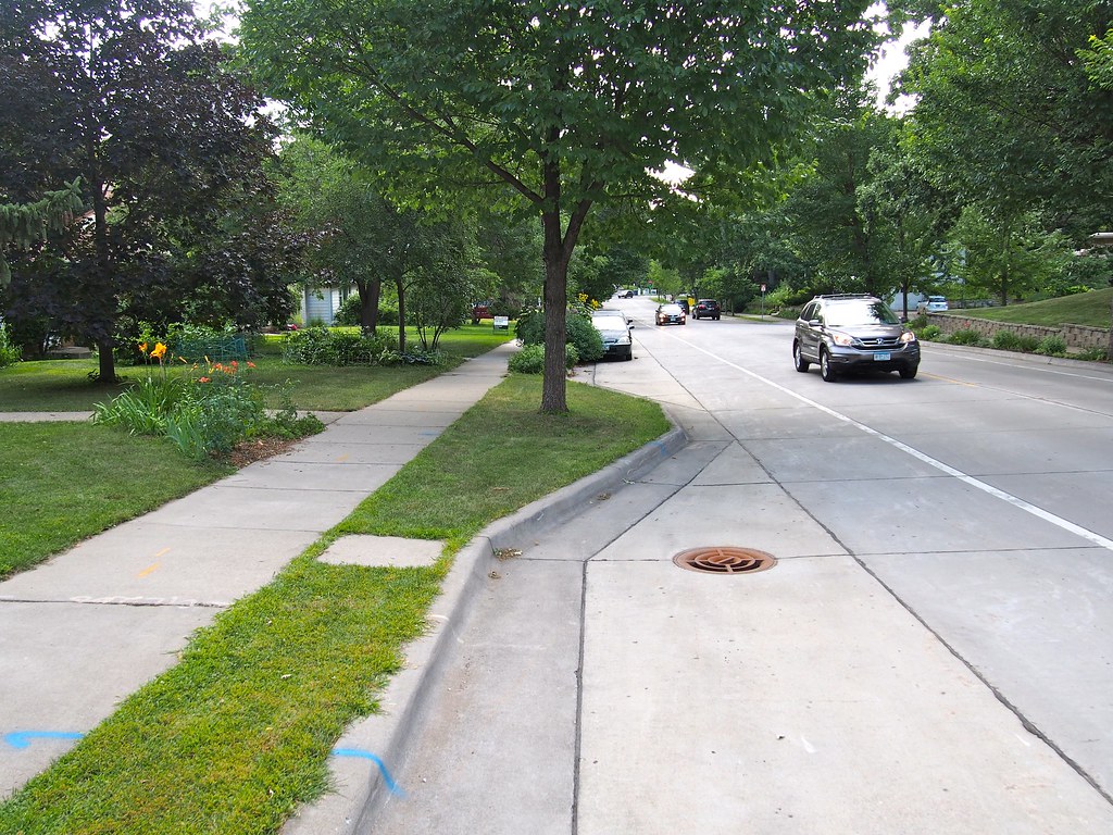 Illustration: Midblock curb extension in parking lane to provide space for greening